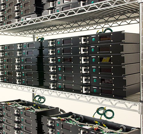 A photo of multiple PDUs stacked up in manufacturing.