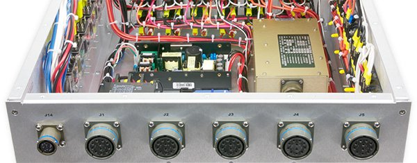 Photo of the inside of a 400 hertz PDU from the rear showing circular connectors on the rear panel.