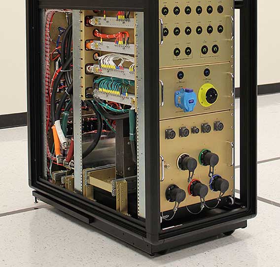 Photo of the lower half of a rack-sized PDU with the panels off to expose complex circuitry and distribution.